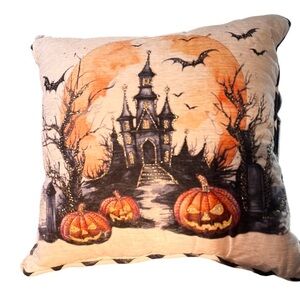 Halloween decorative throw pillow haunted castle and pumpkins.